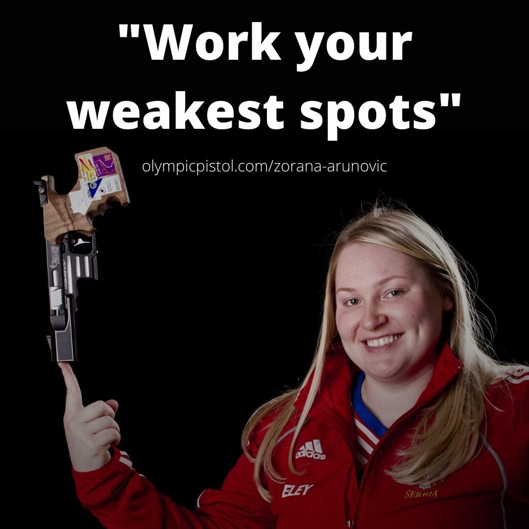 Zorana Arunovic balancing a pistol on the tip of her finger